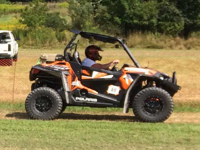 orange and black RZR side by side