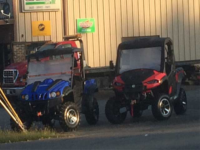 red and blue UTVs